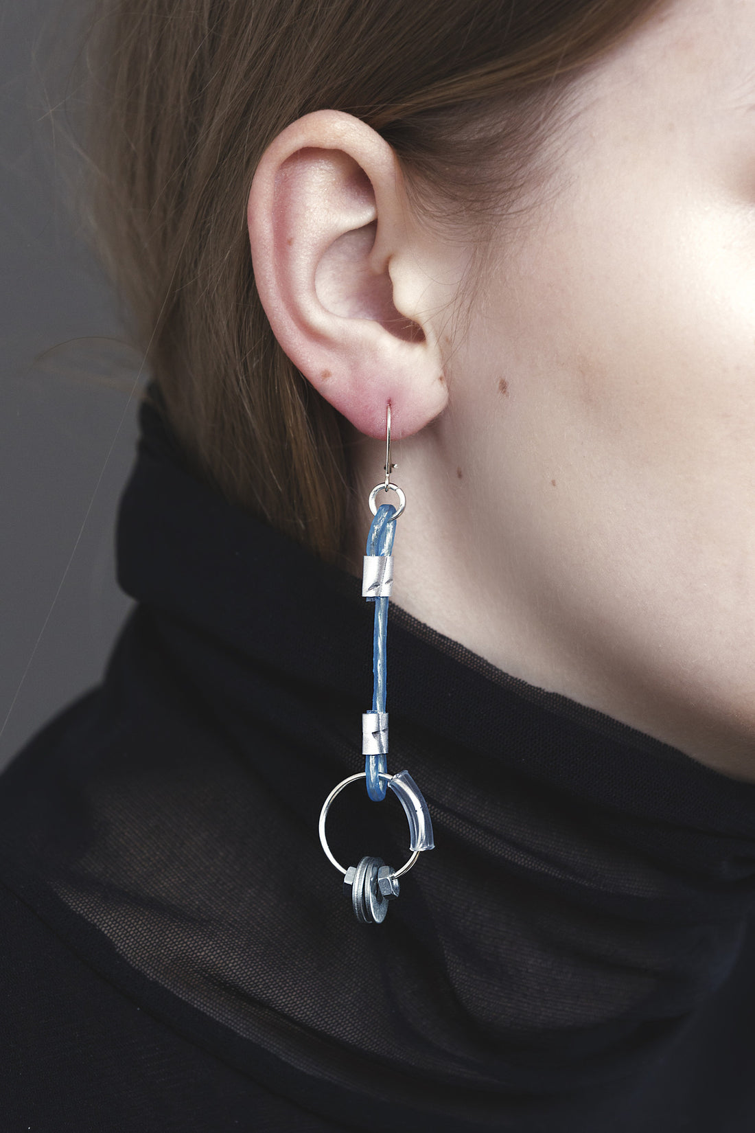 earrings with metal details and silver pins