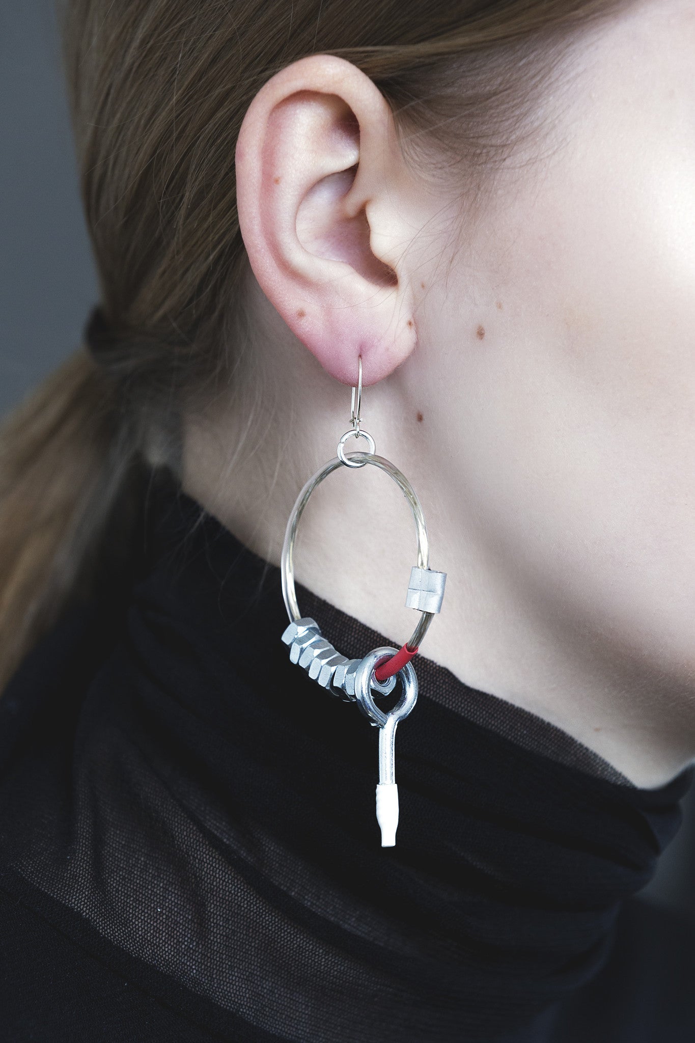 earrings with metal details and silver pins