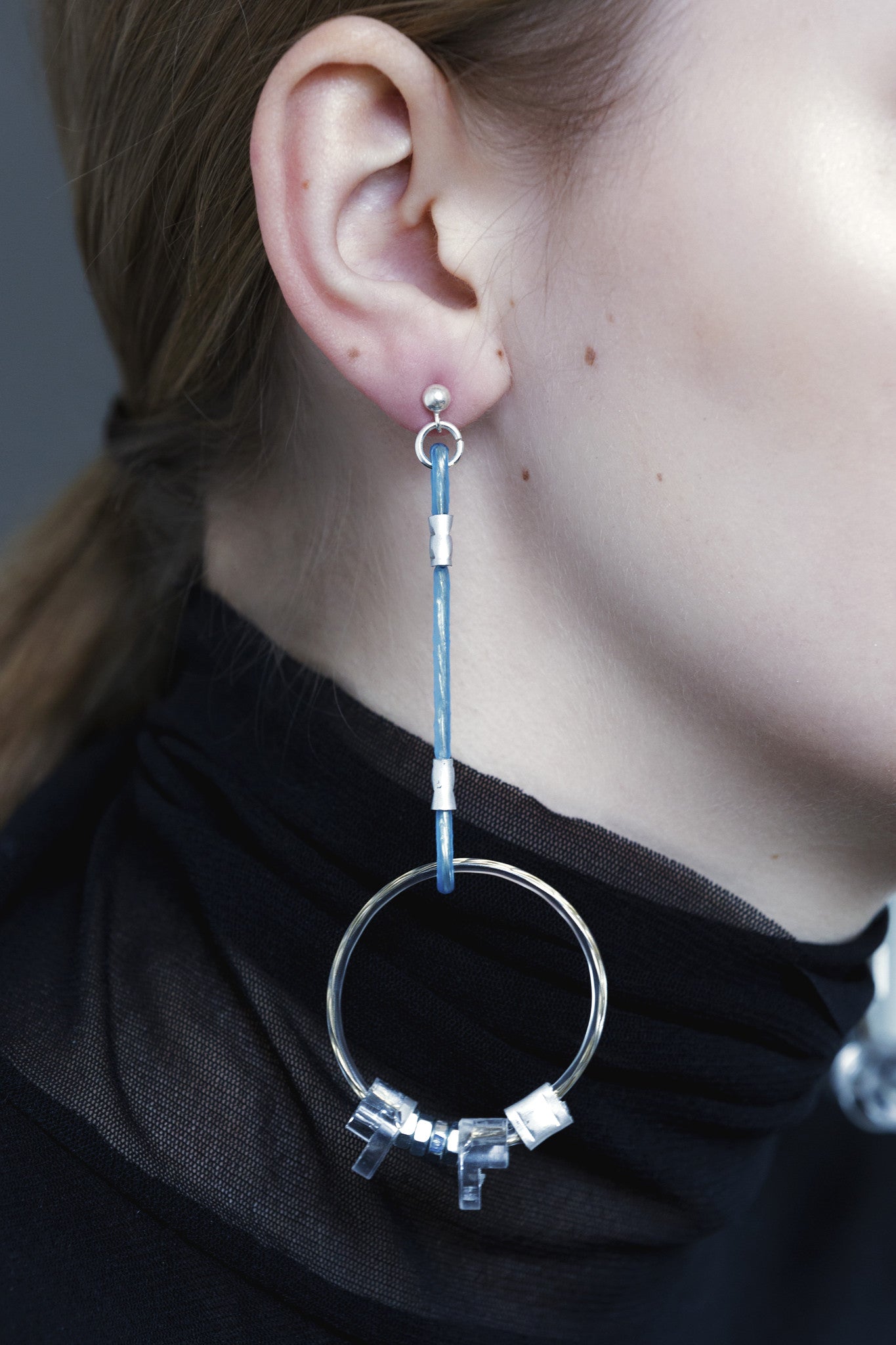 earrings with metal details and silver pins