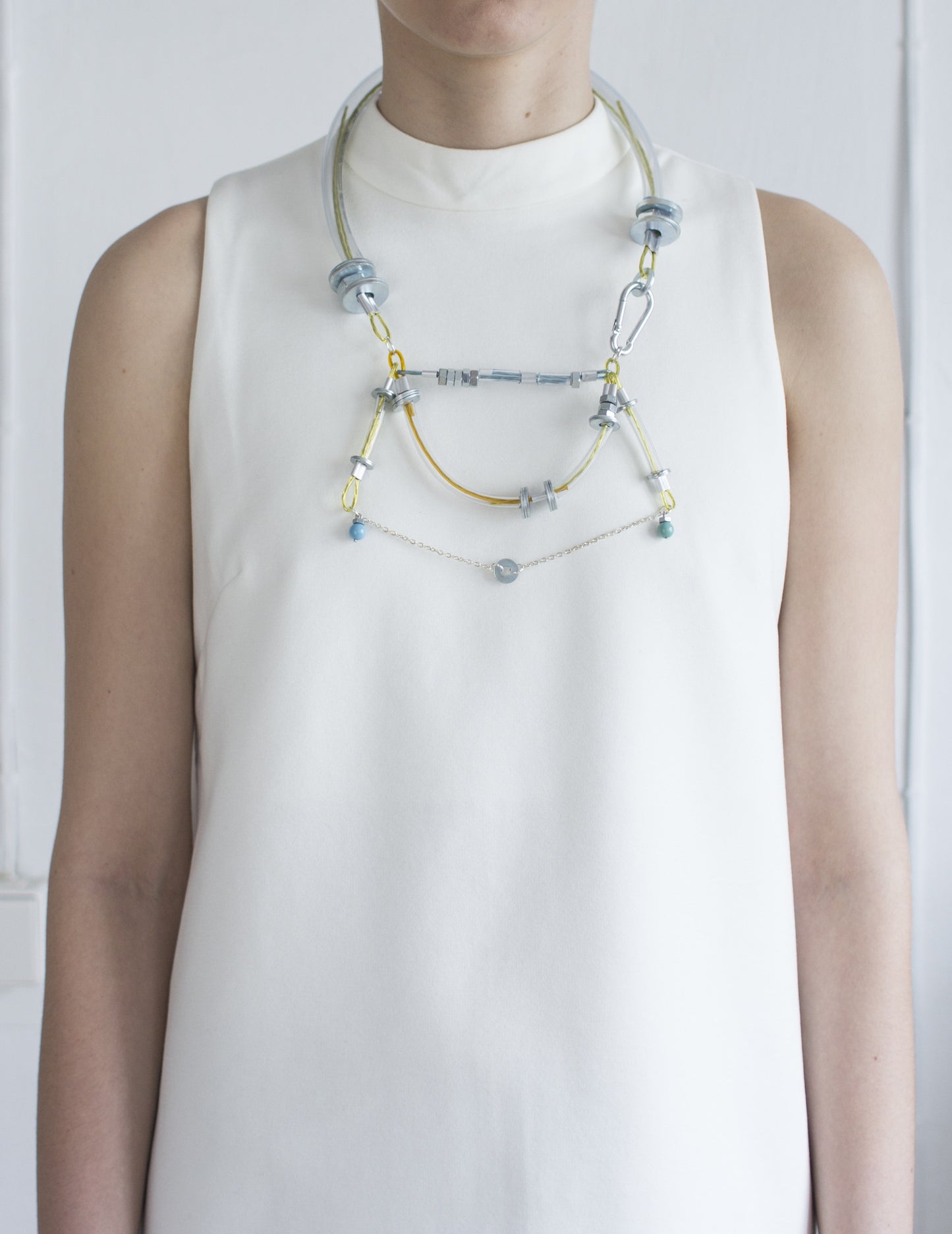 Industrial design necklace with metal details and swarovski pearls